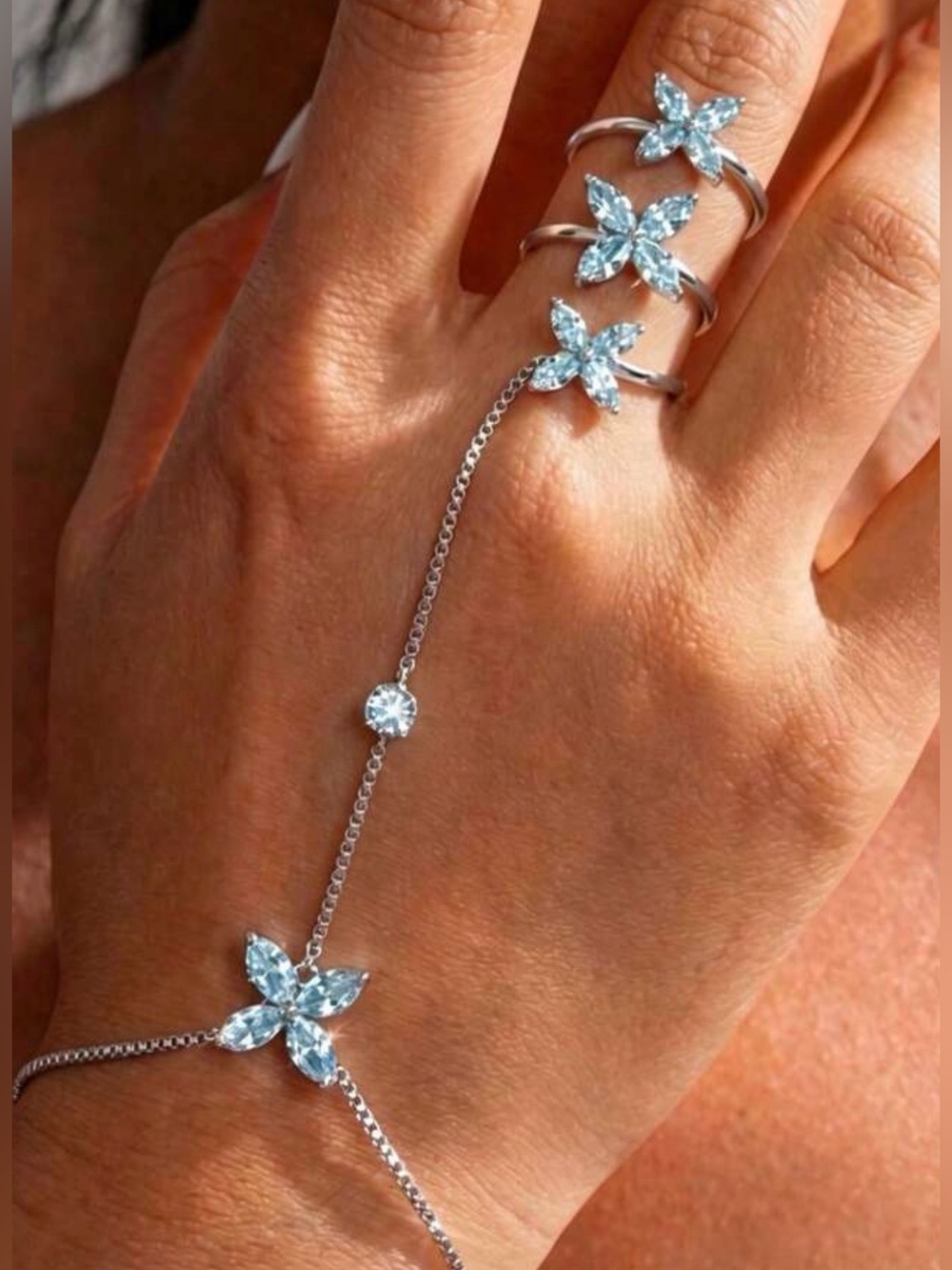 Silver Hand Chain with Light Blue Flower Crystal Accents